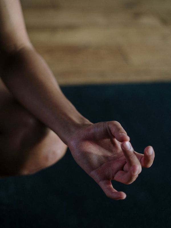 Detail of yoga hand mudra during meditation practice